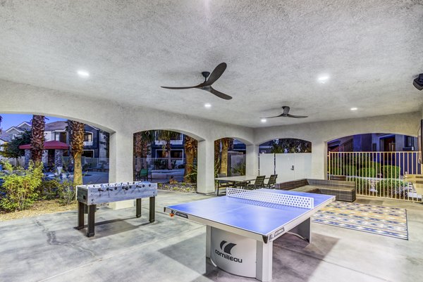 Patio and recreational area at Tesoro Ranch Apartments with seating and fire pit, a luxury community for relaxation and enjoyment