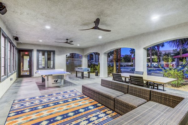 Patio area featuring modern outdoor seating and lush landscaping at Tesoro Ranch Apartments Ideal for relaxation and social gatherings