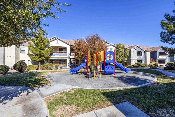 Playground area featuring modern play equipment at Tesoro Ranch Apartments, a Greystar luxury community