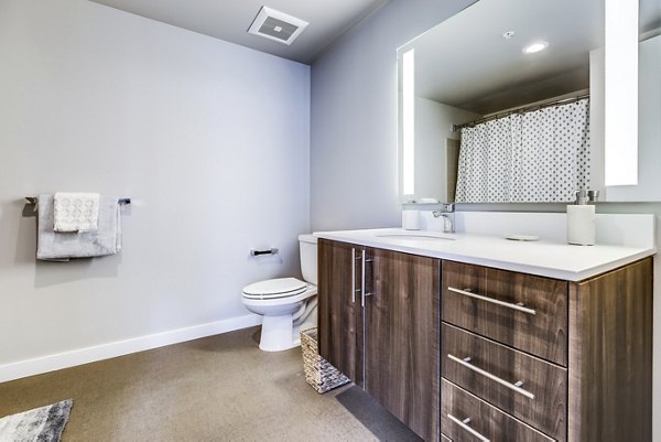 Modern bathroom with sleek fixtures at Sequel Apartments in Greystar luxury living community