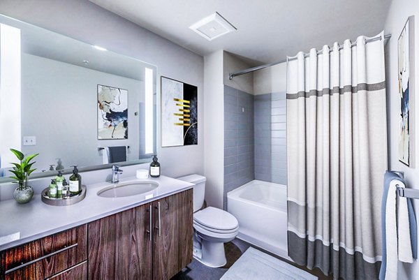 Luxurious bathroom with modern fixtures at Sequel Apartments in a Greystar luxury living community