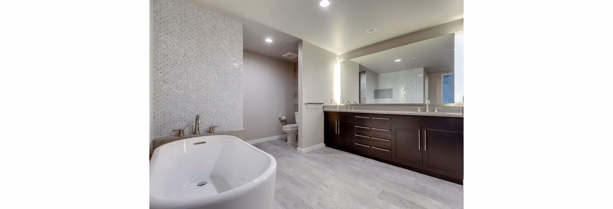 Bathroom featuring sleek modern fixtures in Sequel Apartments