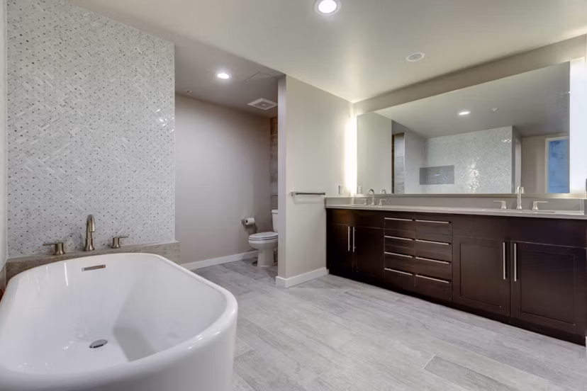 Bathroom featuring sleek modern fixtures in Sequel Apartments