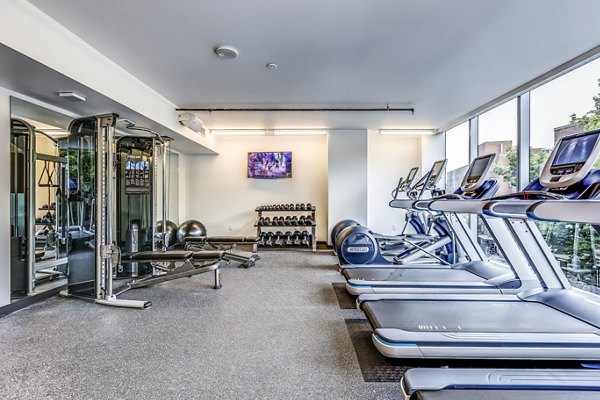 Modern fitness center with state-of-the-art equipment at Sequel Apartments