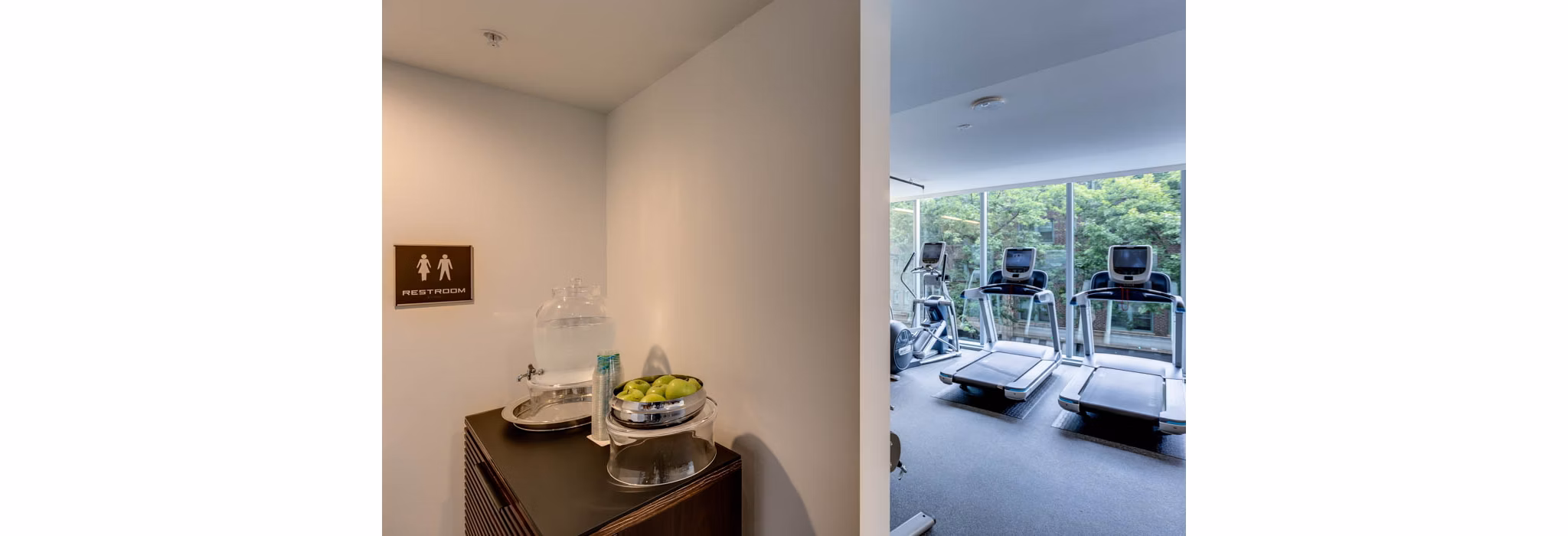 Fully-equipped fitness room with modern machines at Sequel Apartments