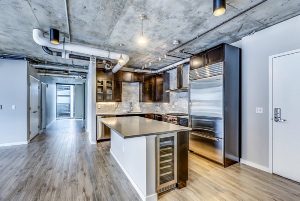 Modern kitchen with stainless steel appliances at Sequel Apartments, a luxury community