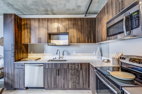Modern kitchen with stainless steel appliances at Sequel Apartments, offering luxury living in Greystar's exclusive community