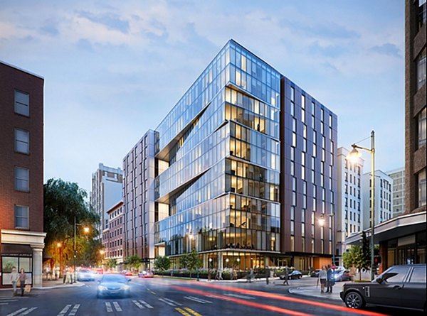 Street view of Sequel Apartments: Modern luxury building design in a vibrant urban setting