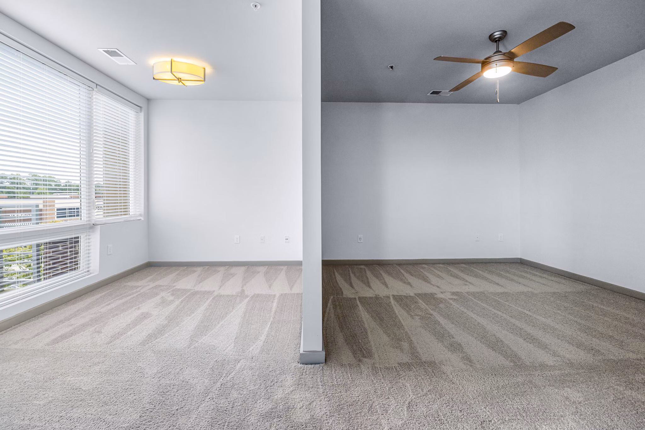 Modern bedroom with sleek furniture at District Lofts Apartments