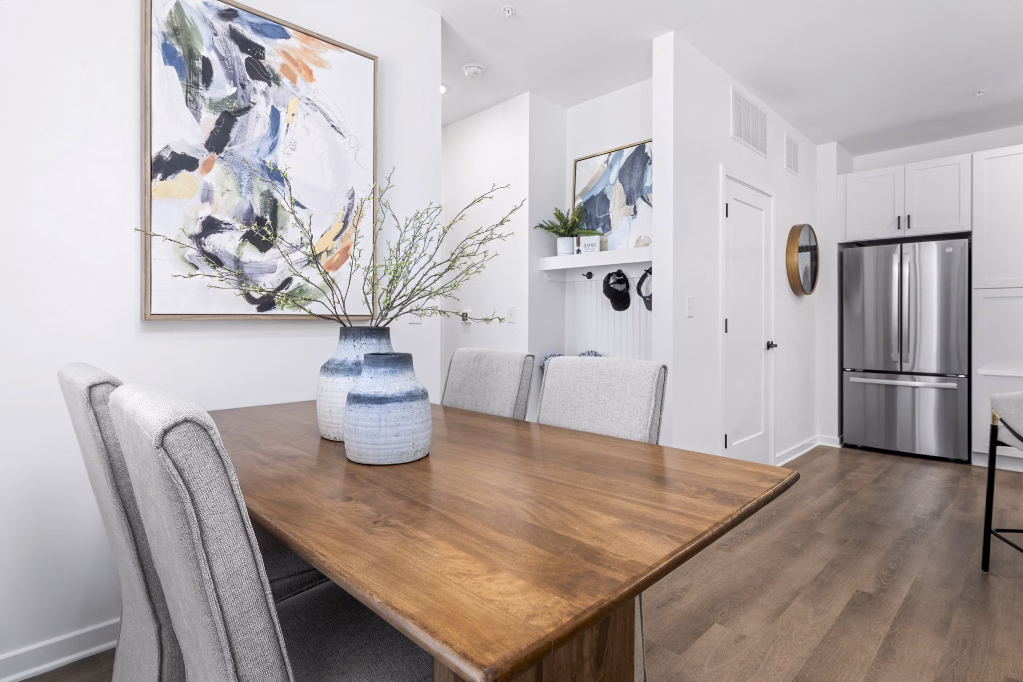Dining room with modern furniture and pendant lighting in District Lofts Apartments