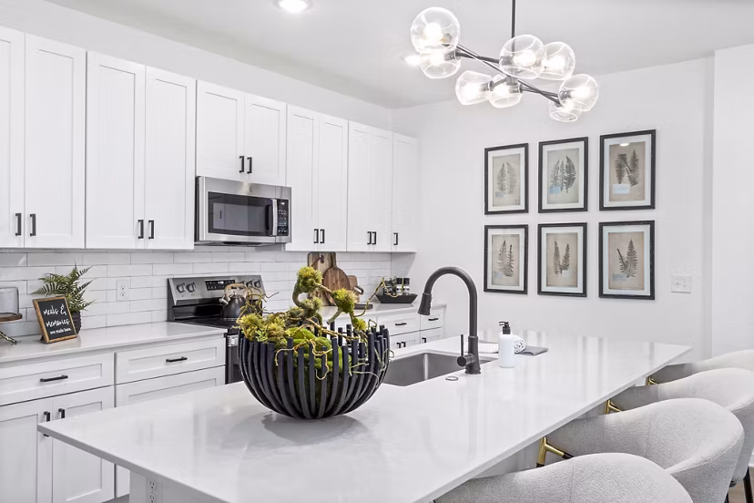 Modern kitchen with stainless steel appliances at District Lofts Apartments