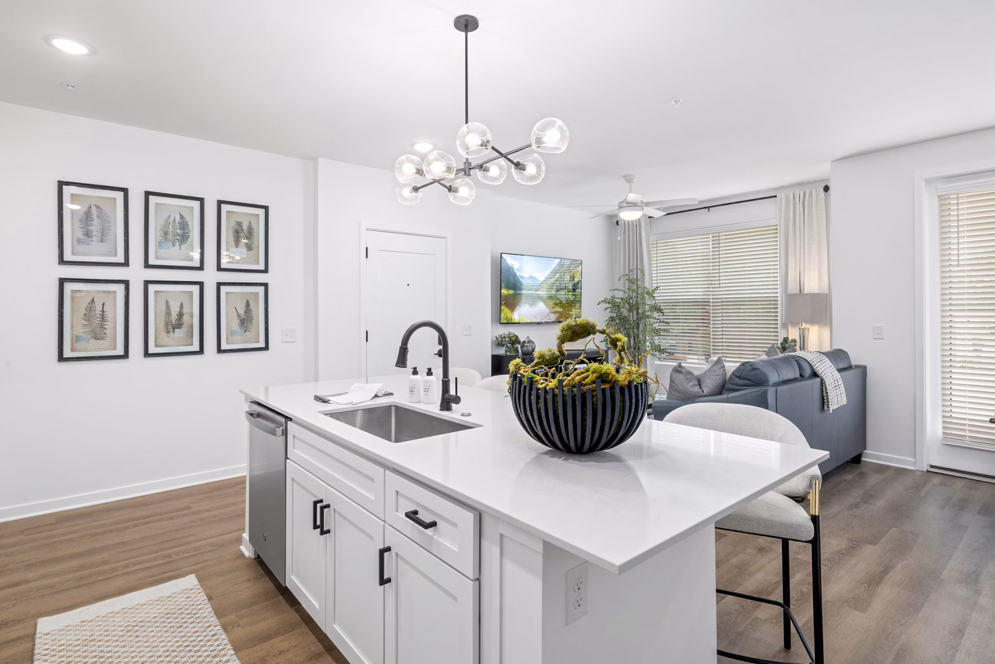 Modern kitchen with stainless steel appliances at District Lofts Apartments, featuring sleek countertops and ample storage space