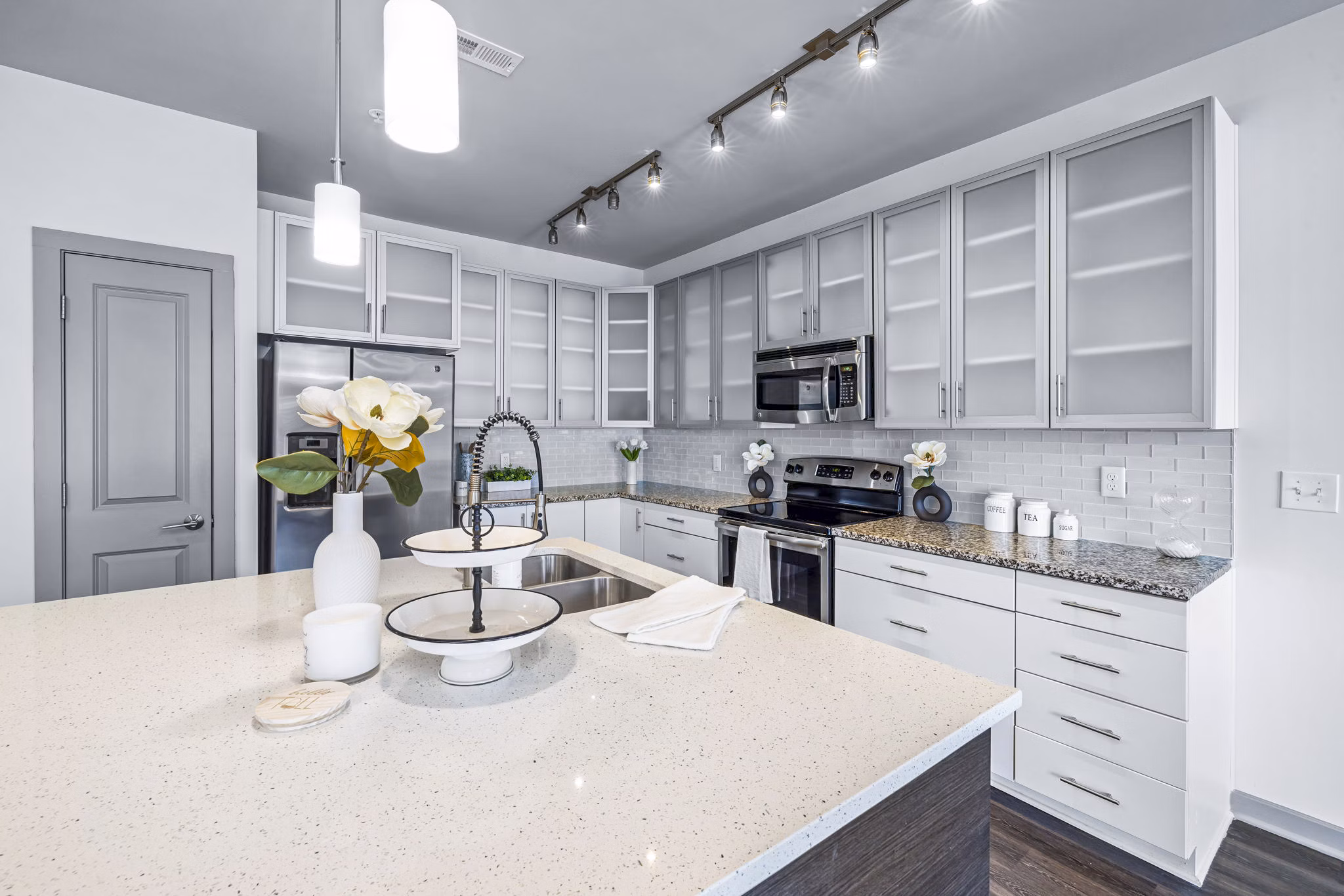 Spacious kitchen with modern appliances in District Lofts Apartments, offering luxury living for residents