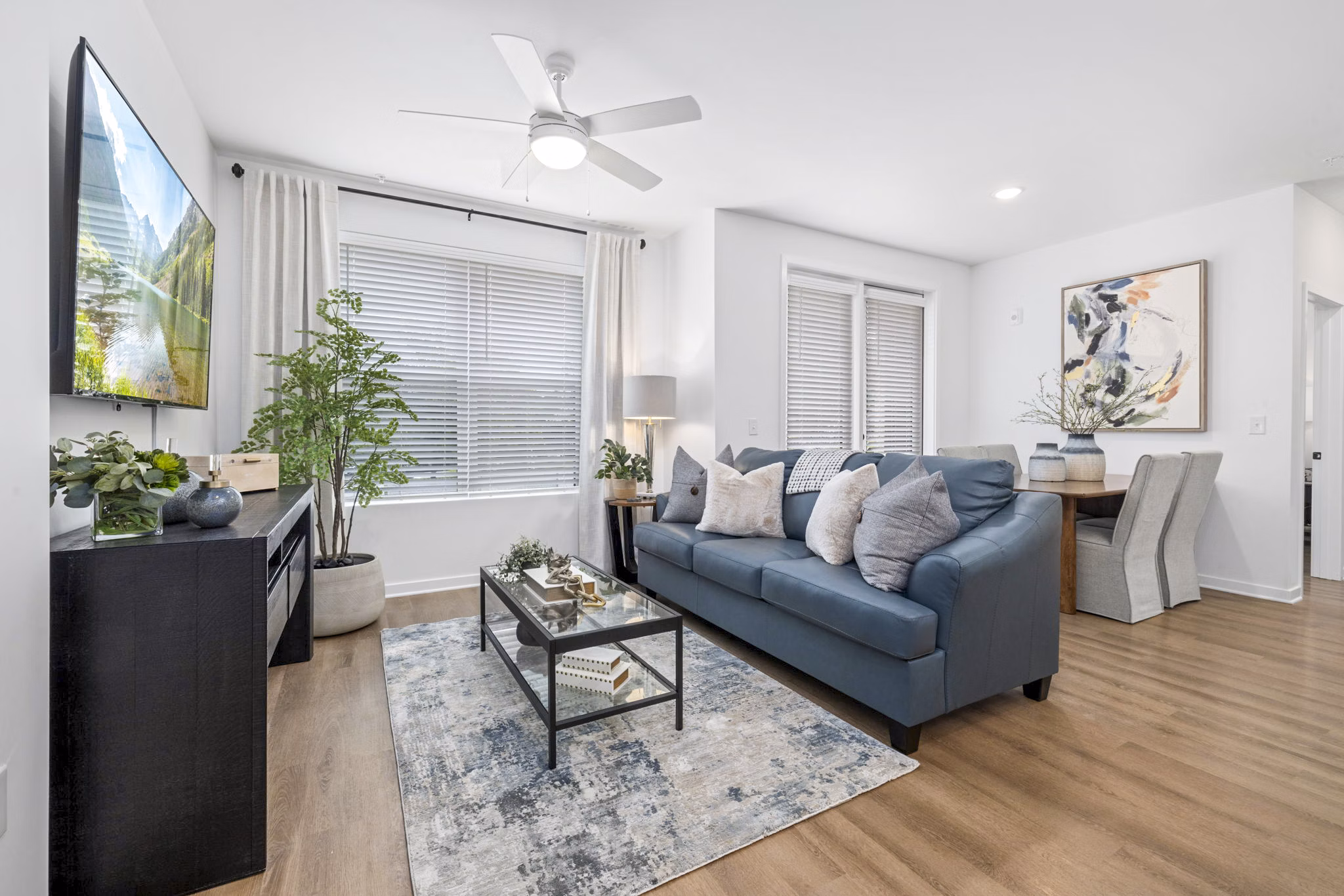 Spacious living room with contemporary decor at District Lofts Apartments
