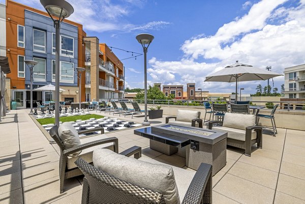 Cozy outdoor patio with fire pit at District Lofts Apartments, a luxury Greystar property