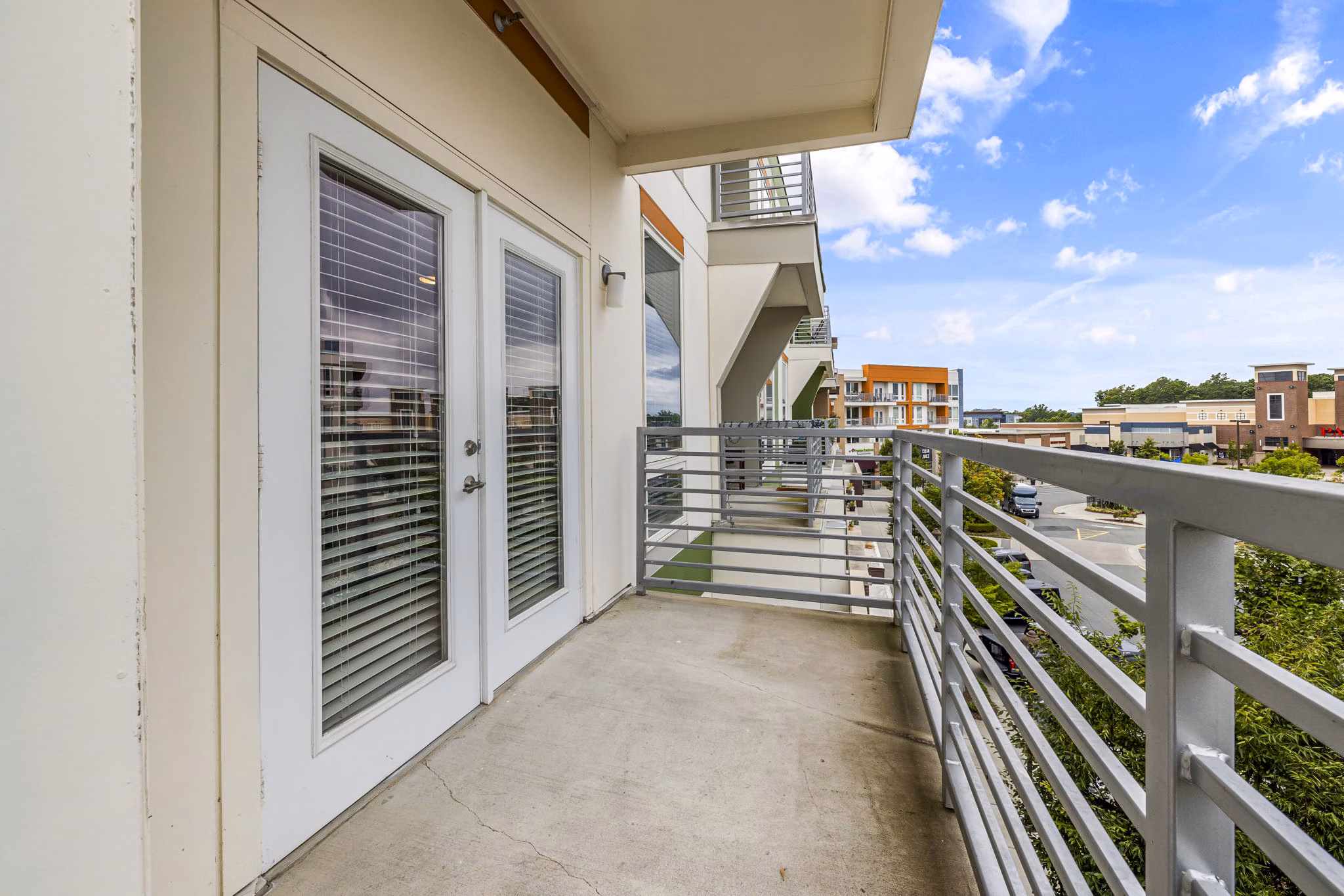 Chic patio with modern furnishings at District Lofts Apartments, perfect for relaxing and enjoying urban views