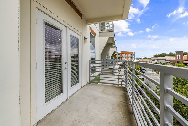 Chic patio with modern furnishings at District Lofts Apartments, perfect for relaxing and enjoying urban views