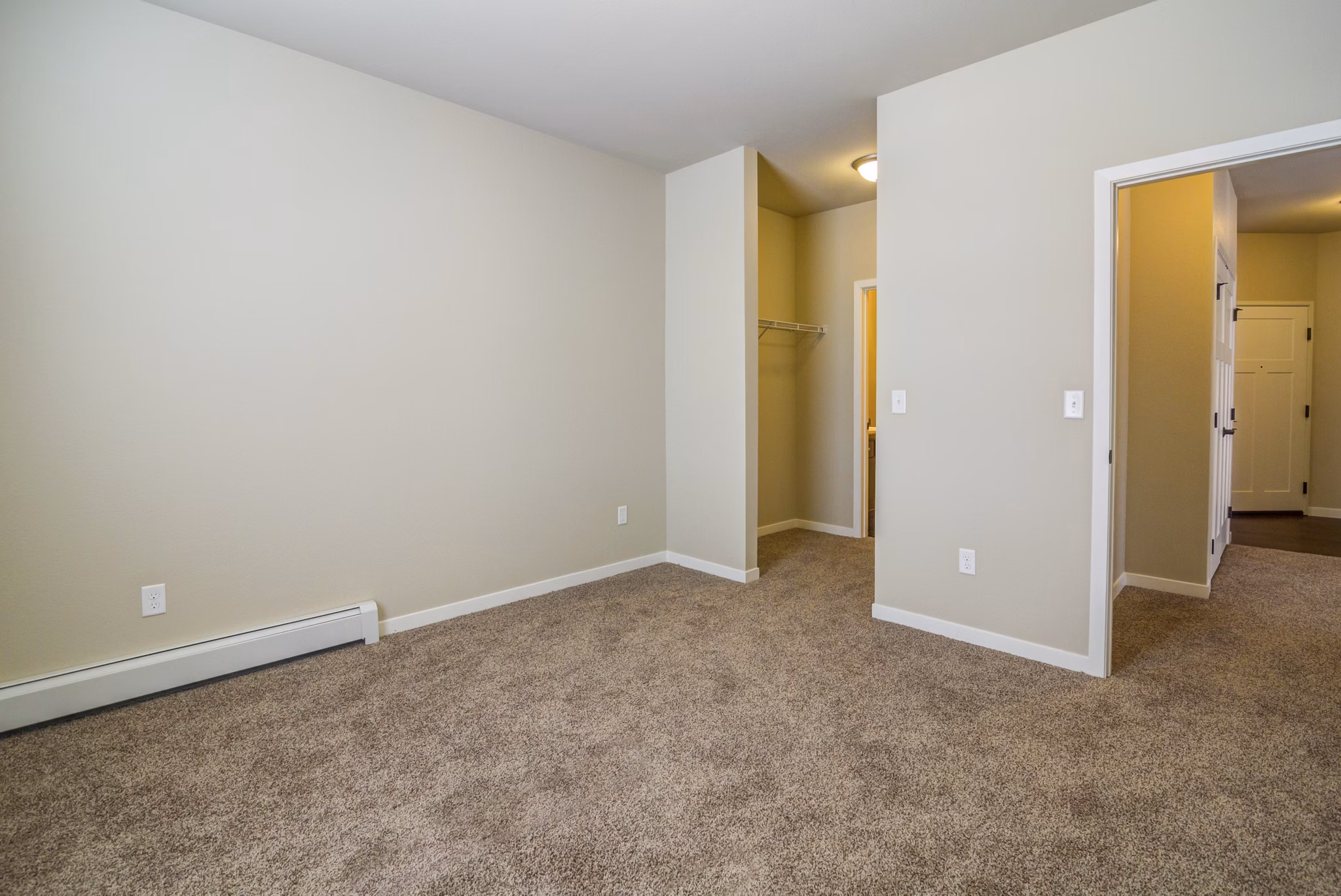 Cozy bedroom featuring stylish decor at South Ridge Apartments