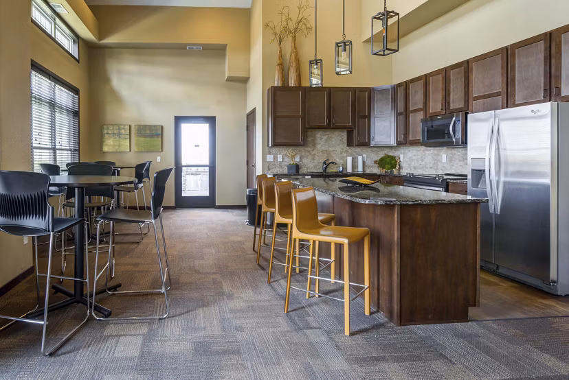 Clubhouse with modern lounge and entertainment area at South Ridge Apartments