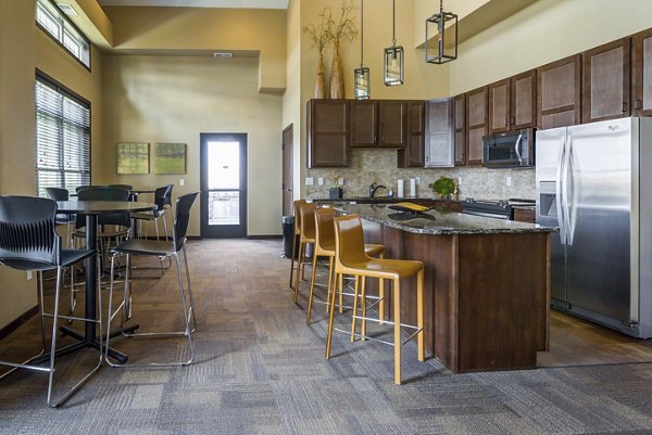 Clubhouse with modern lounge and entertainment area at South Ridge Apartments