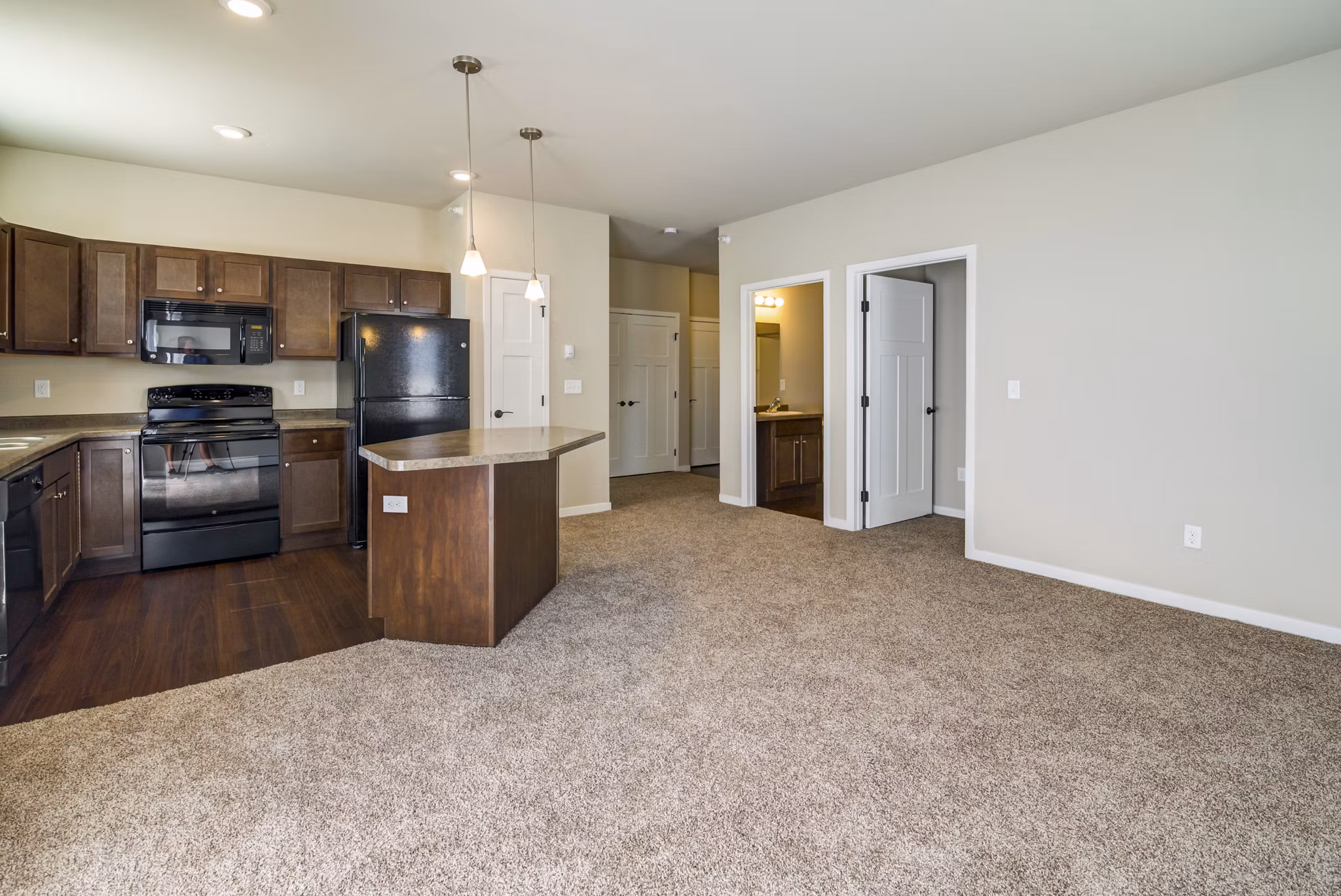 South Ridge Apartments: Stylish living room with contemporary decor and natural lighting