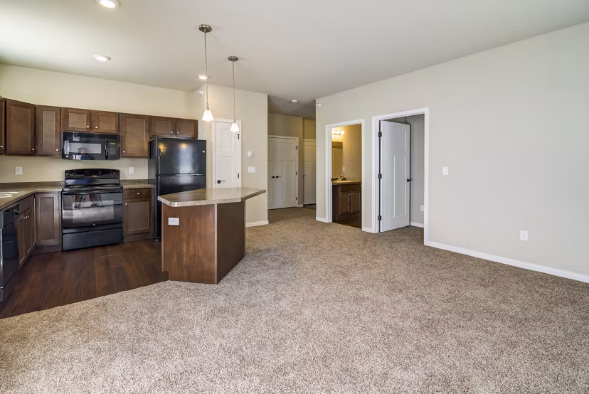 South Ridge Apartments: Stylish living room with contemporary decor and natural lighting