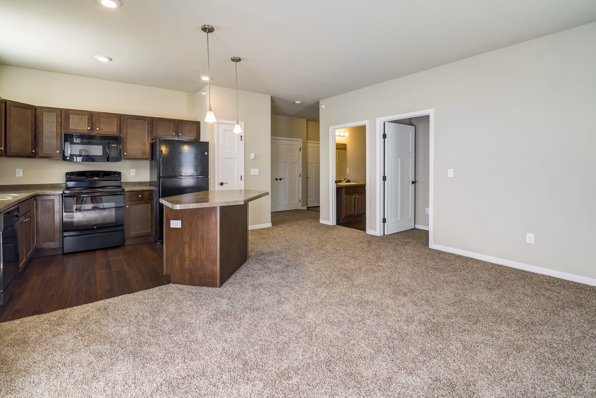 South Ridge Apartments: Stylish living room with contemporary decor and natural lighting