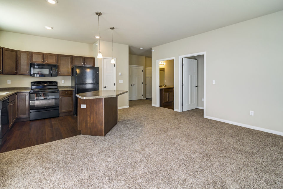 South Ridge Apartments: Stylish living room with contemporary decor and natural lighting