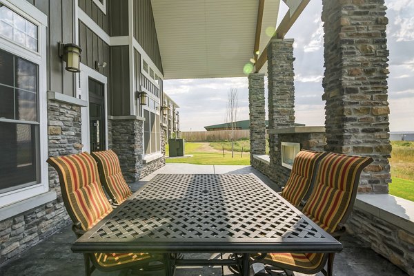 Spacious outdoor patio with modern furniture at South Ridge Apartments