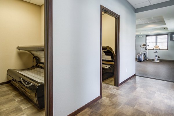 Tanning salon with modern facilities at South Ridge Apartments, offering luxury amenities and convenience