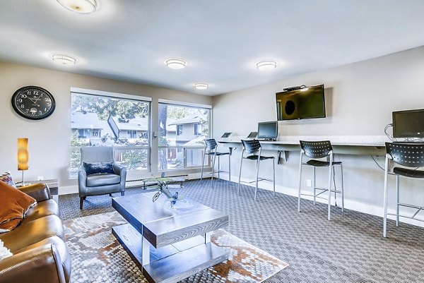 Clubhouse business center featuring modern workstations at Park 120 Apartments