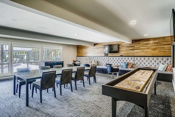 Clubhouse game room with billiards and lounge seating at Park 120 Apartments, luxury living with premium amenities