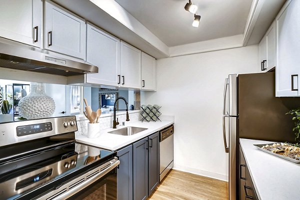 Modern kitchen with stainless steel appliances in Park 120 Apartments' luxury homes