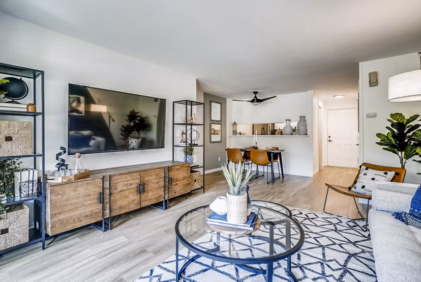 Bright living room with modern furnishings at Park 120 Apartments, offering stylish luxury living in a prime location