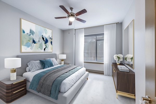 Modern bedroom with plush bedding at Ashton at Judiciary Square Apartments
