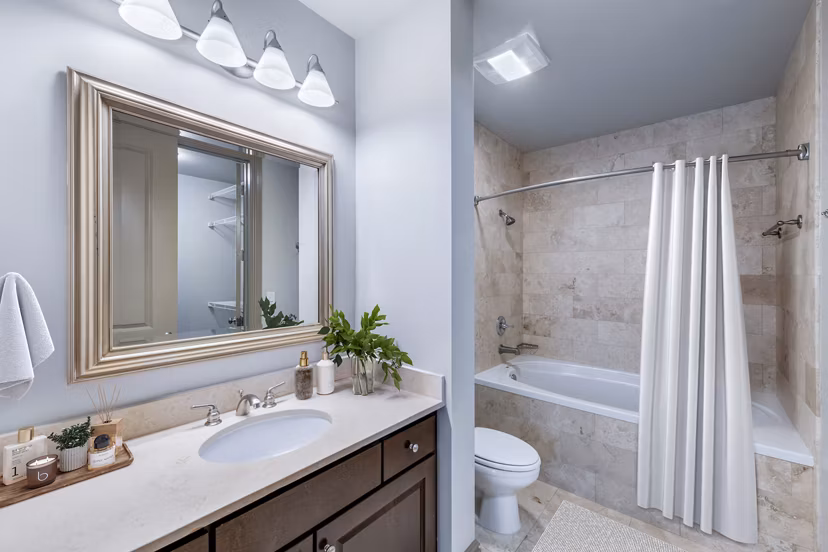 Bathroom featuring modern fixtures and elegant tile at Ashton at Judiciary Square Apartments