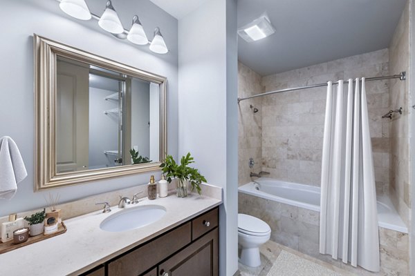 Bathroom featuring modern fixtures and elegant tile at Ashton at Judiciary Square Apartments