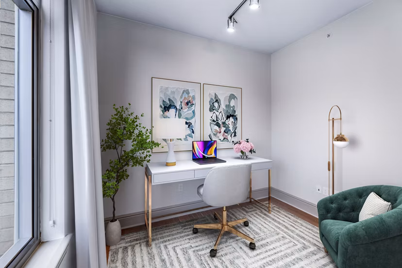 Home office space with ergonomic desk and chair in Ashton at Judiciary Square Apartments, ideal for remote work and productivity
