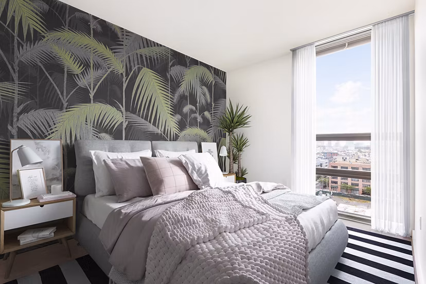 Cozy bedroom with modern design elements in VINE Apartments