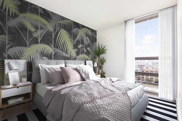 Cozy bedroom with modern design elements in VINE Apartments