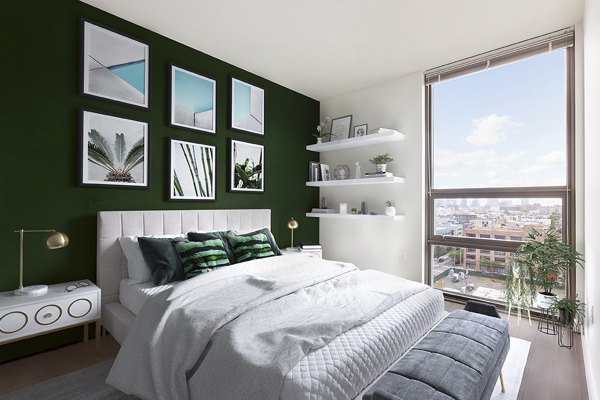 Spacious bedroom with modern decor at VINE Apartments