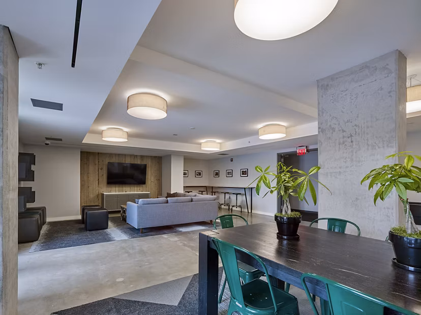 Elegant clubhouse with modern seating at VINE Apartments, a Greystar property offering luxury living
