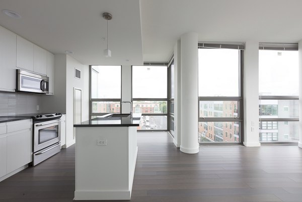 Dining room with elegant table setting and designer lighting at VINE Apartments luxury community
