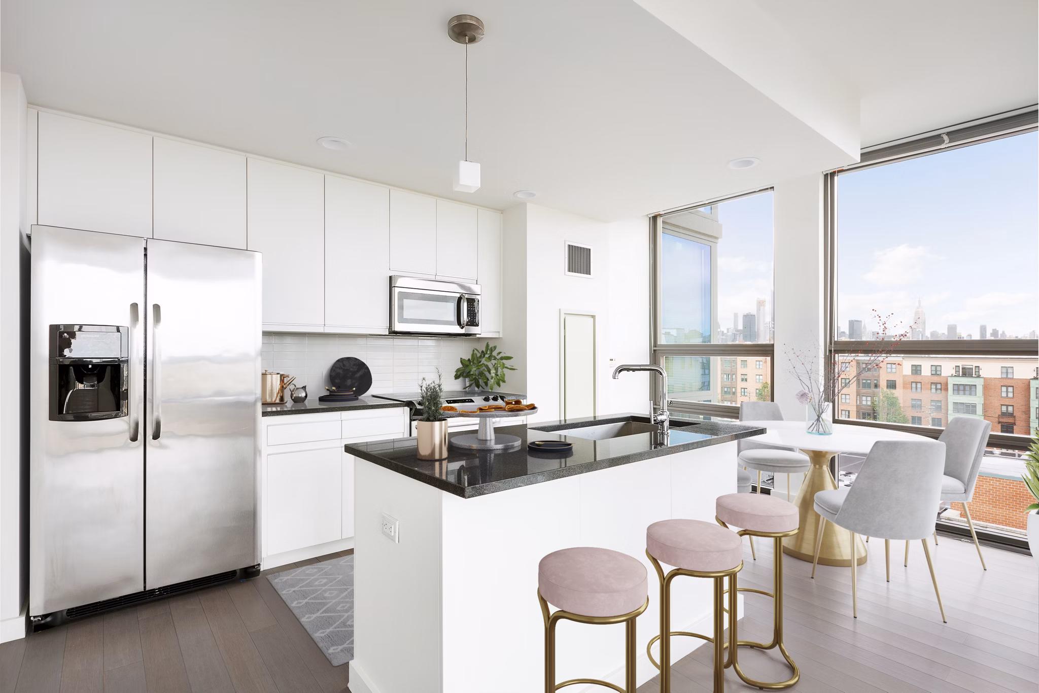 Modern kitchen with stainless steel appliances at VINE Apartments
