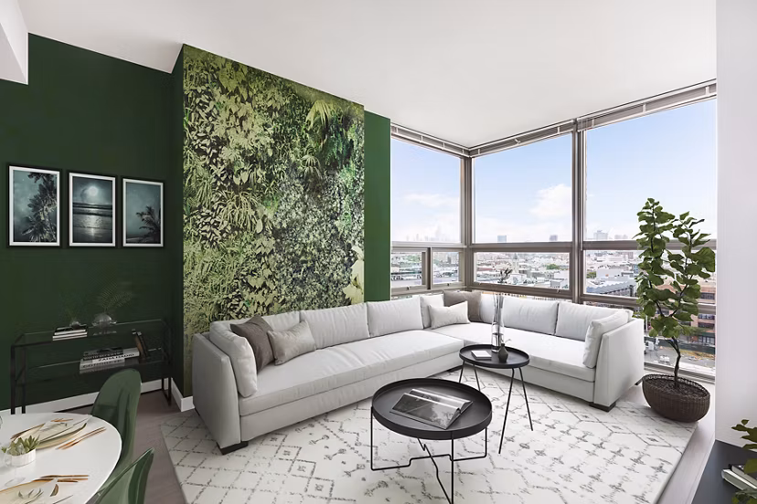 Modern living room with sleek furniture featuring a cozy ambiance at VINE Apartments