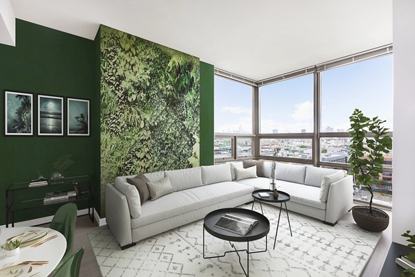 Modern living room with sleek furniture featuring a cozy ambiance at VINE Apartments