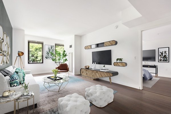 Contemporary living room with stylish furniture at VINE Apartments offering luxury urban living