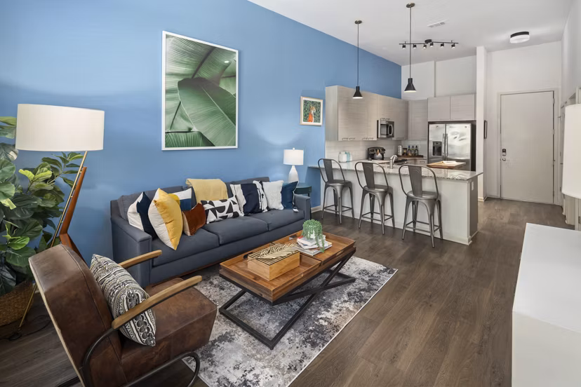 Clubhouse with modern seating and entertainment area at 1133 on the Square Apartments