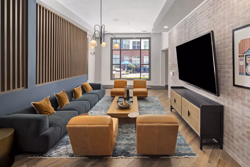 Elegant clubhouse featuring plush seating and modern decor at 1133 on the Square Apartments