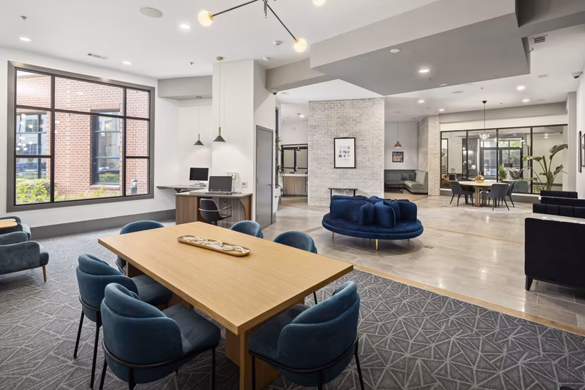 Clubhouse featuring a modern lounge area and billiards table at 1133 on the Square Apartments Ideal for social gatherings and relaxation